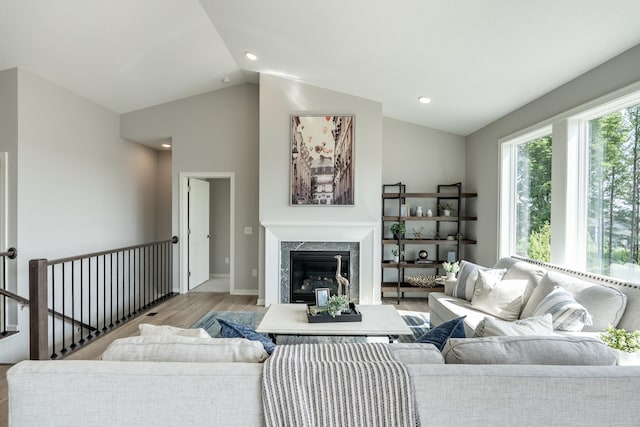 9176 62nd St S, Cottage Grove, MN 55016 - living room featuring wood finished floors, lofted ceiling, a fireplace, and recessed lighting