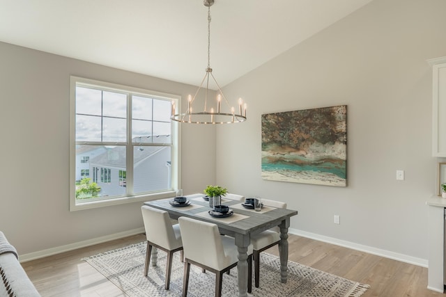 9176 62nd St S, Cottage Grove, MN 55016 - dining space featuring a chandelier, light wood finished floors, plenty of natural light, and vaulted ceiling