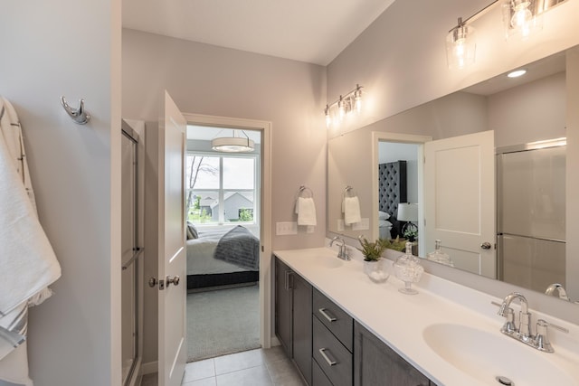 9176 62nd St S, Cottage Grove, MN 55016 - bathroom featuring double vanity, a shower stall, tile patterned floors, and ensuite bath