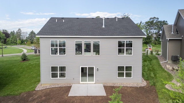 9176 62nd St S, Cottage Grove, MN 55016 - back of property featuring a patio area, a yard, and roof with shingles