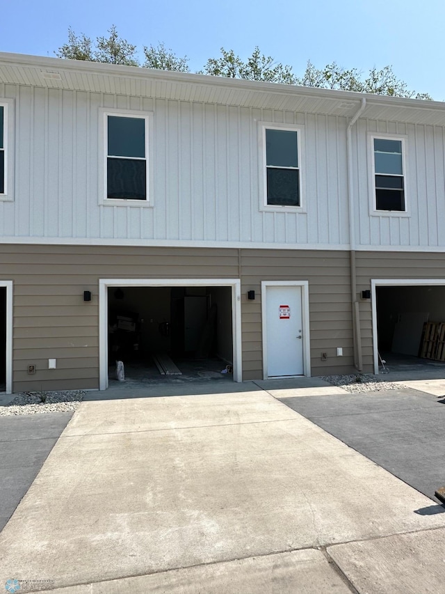 view of front of house with concrete driveway and an attached garage