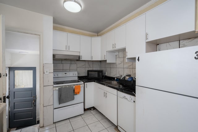 kitchen featuring white appliances, under cabinet range hood, white cabinetry, crown molding, and tasteful backsplash