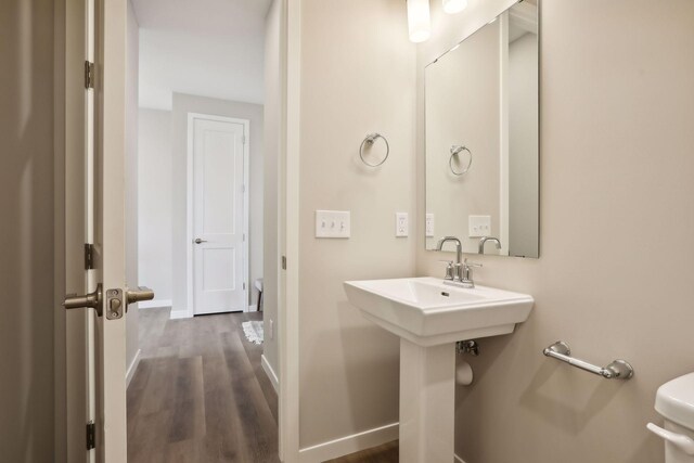 9184 62nd St S, Cottage Grove, MN 55016 - half bathroom with baseboards and wood finished floors