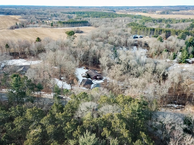 birds eye view of property featuring a view of trees