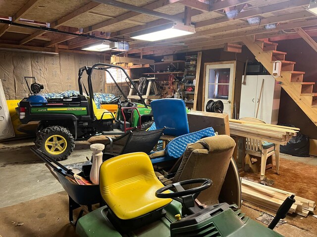 interior space featuring a garage door opener and wood walls