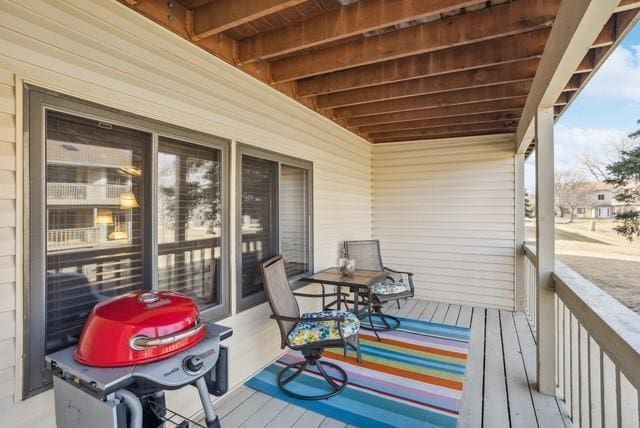 wooden deck featuring area for grilling