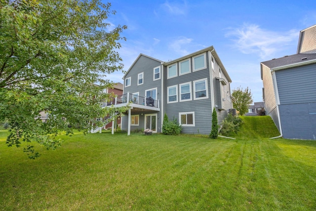 back of house featuring a wooden deck, stairs, and a yard