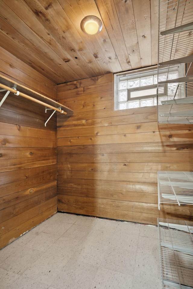 walk in closet with tile patterned floors