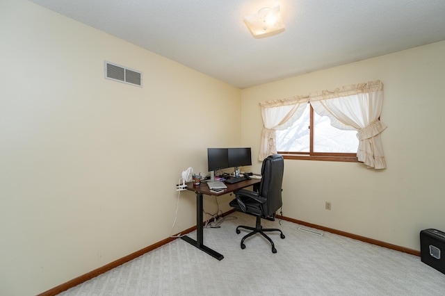 office featuring visible vents, carpet flooring, and baseboards