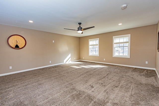 empty room featuring recessed lighting, baseboards, carpet floors, and ceiling fan