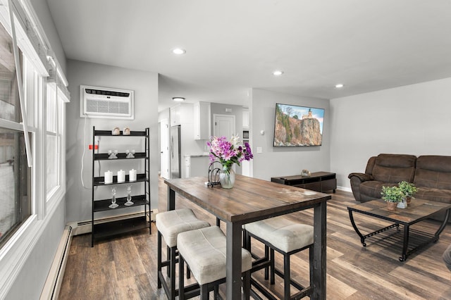 dining room featuring a wall unit AC, recessed lighting, dark wood-style flooring, and a baseboard radiator