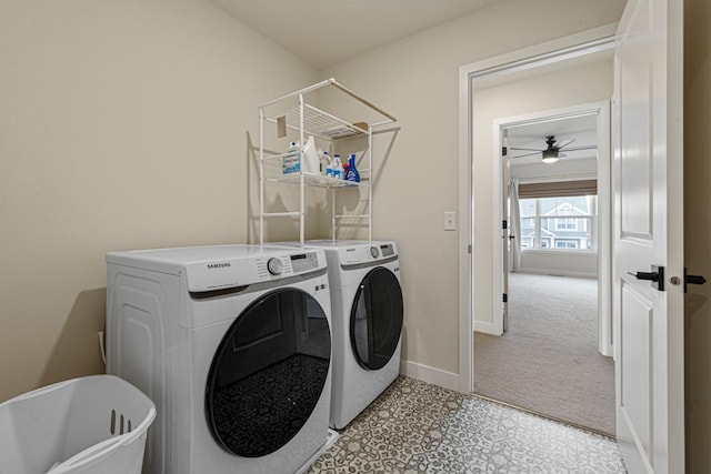 laundry room featuring washer and dryer, baseboards, and laundry area