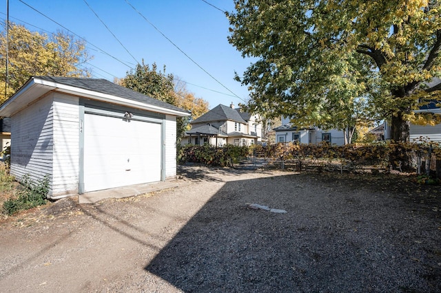 detached garage featuring driveway