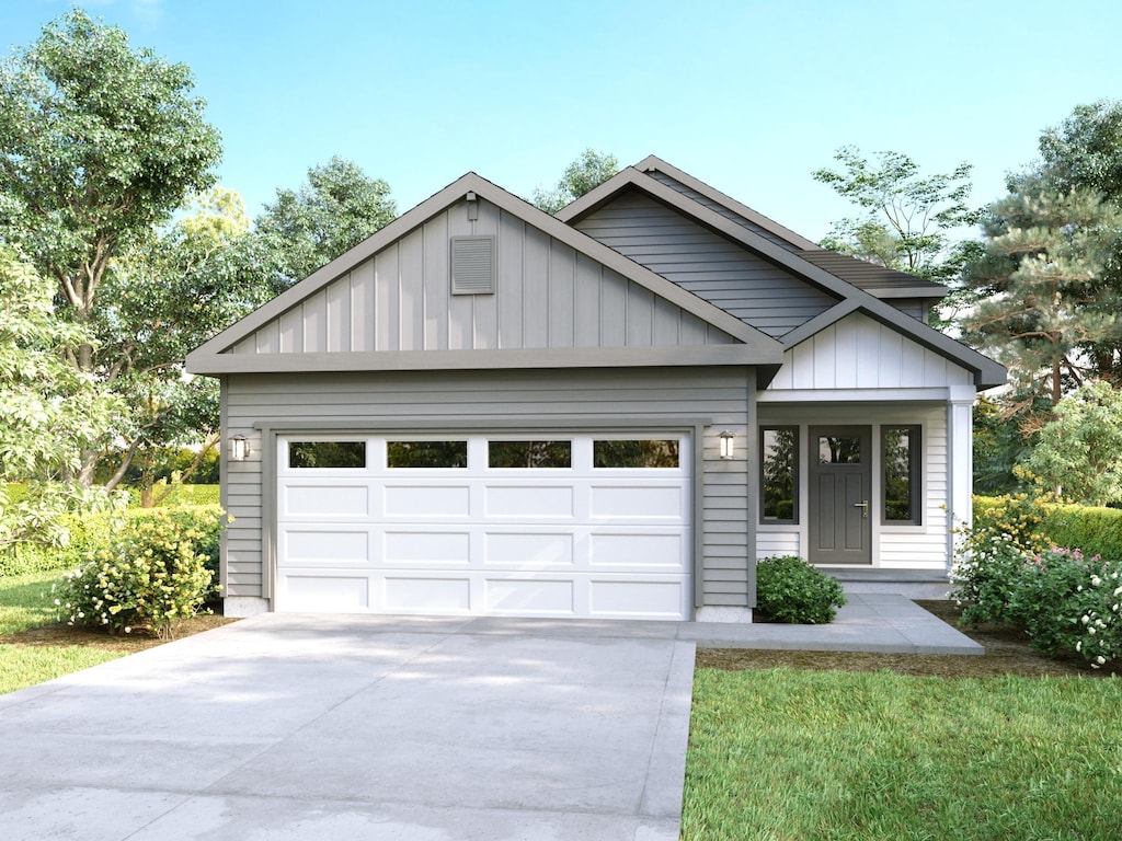 modern farmhouse featuring a garage, board and batten siding, and driveway