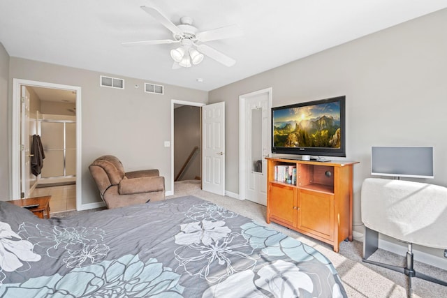 bedroom featuring visible vents, light colored carpet, connected bathroom, and baseboards