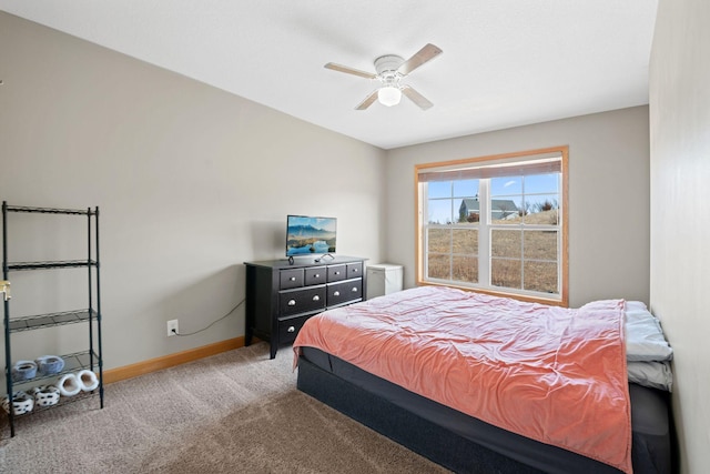 bedroom featuring ceiling fan, baseboards, and carpet