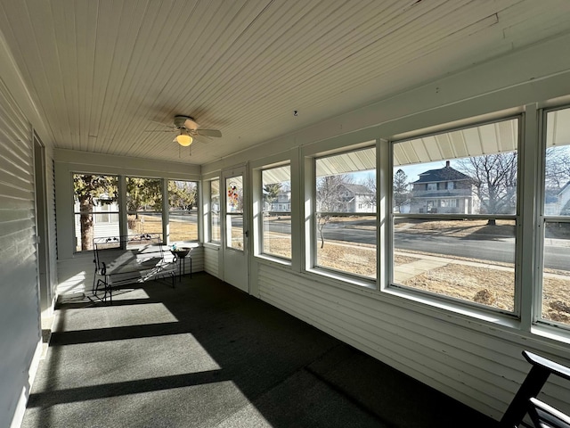 sunroom with plenty of natural light and ceiling fan