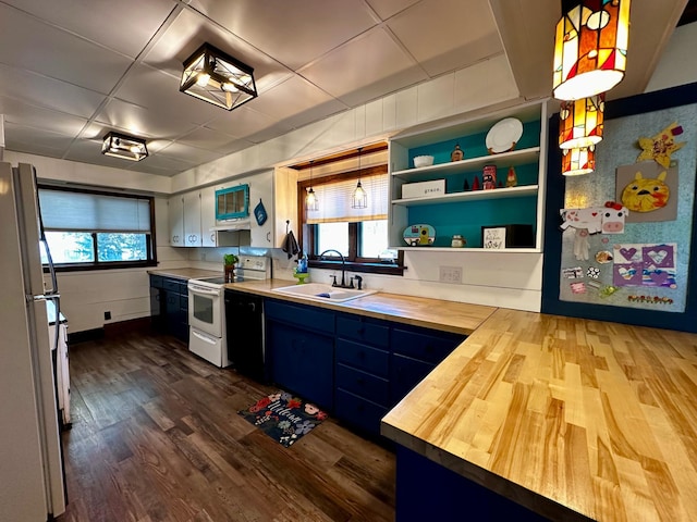 kitchen with white appliances, wooden counters, dark wood finished floors, a sink, and blue cabinets