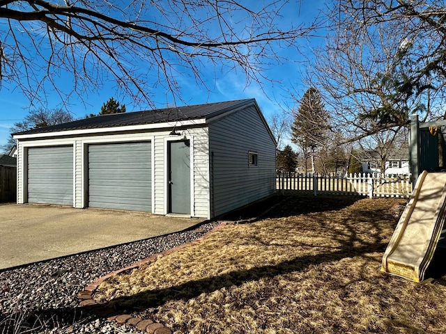 detached garage with fence