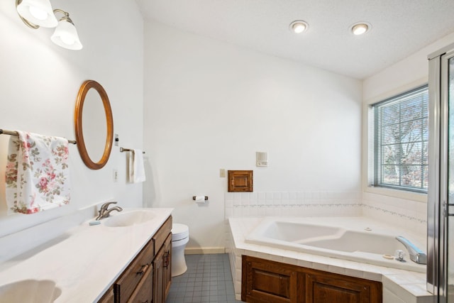 full bath with a garden tub, toilet, double vanity, and a sink