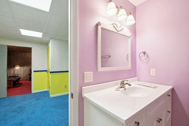 bathroom featuring vanity and a paneled ceiling