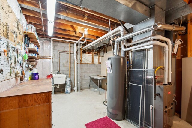 unfinished below grade area featuring water heater and a sink