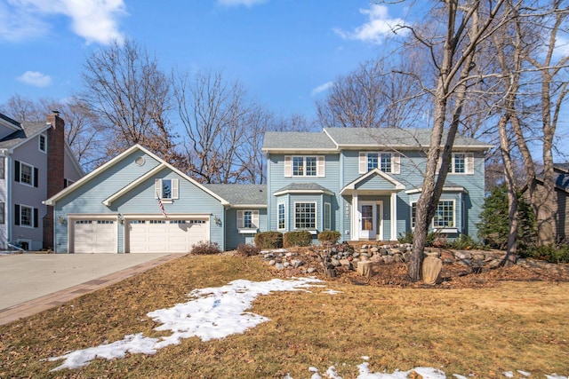 view of front of property featuring a garage and driveway