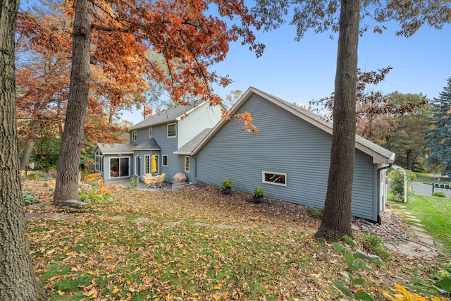 rear view of property featuring a patio