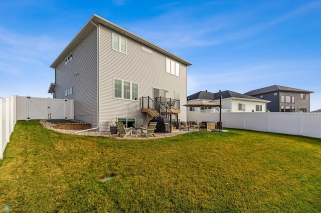 back of house featuring a patio, a gate, an outdoor living space, a fenced backyard, and a lawn