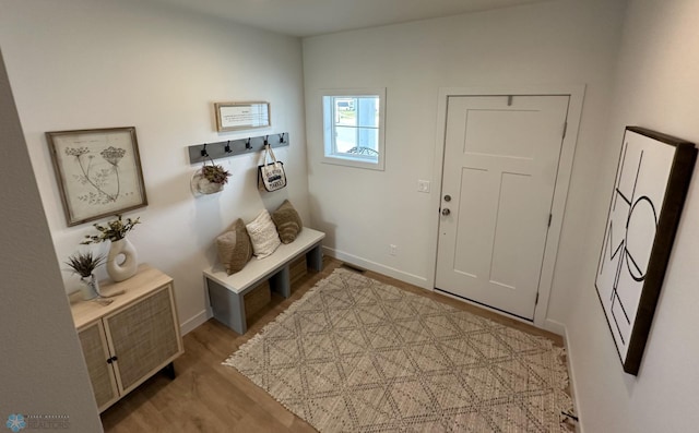 interior space with light wood-style flooring and baseboards