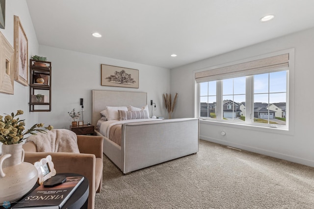 bedroom with recessed lighting, baseboards, and carpet floors