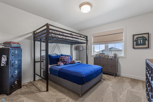 carpeted bedroom with baseboards