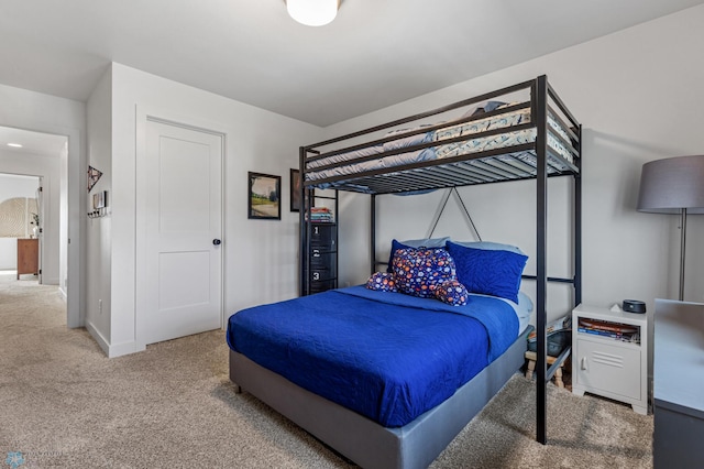 carpeted bedroom with baseboards