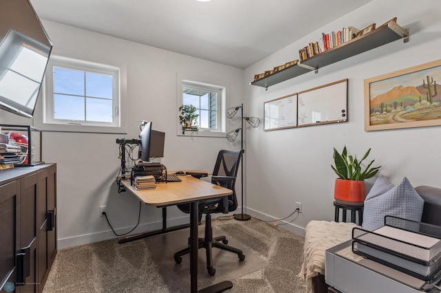 carpeted office space featuring baseboards