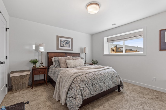 bedroom featuring baseboards and carpet floors