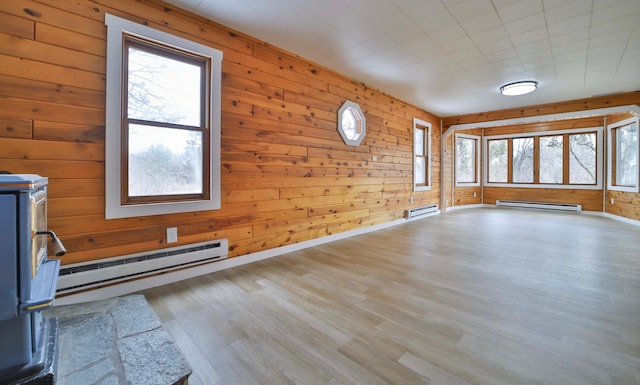 interior space with plenty of natural light and baseboard heating