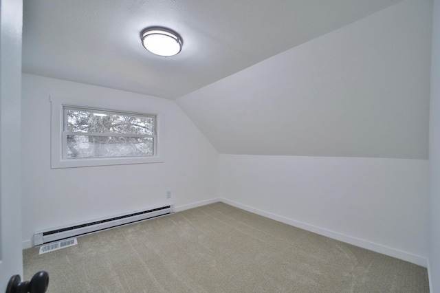 additional living space with baseboards, baseboard heating, lofted ceiling, and light colored carpet