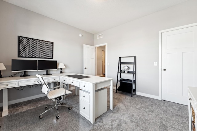 office space featuring light carpet, visible vents, and baseboards