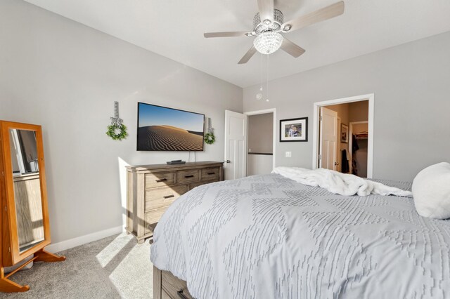 carpeted bedroom with baseboards and a ceiling fan