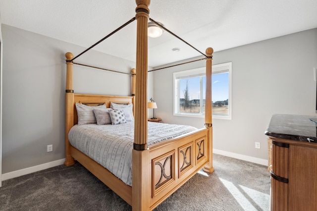 bedroom featuring baseboards and carpet