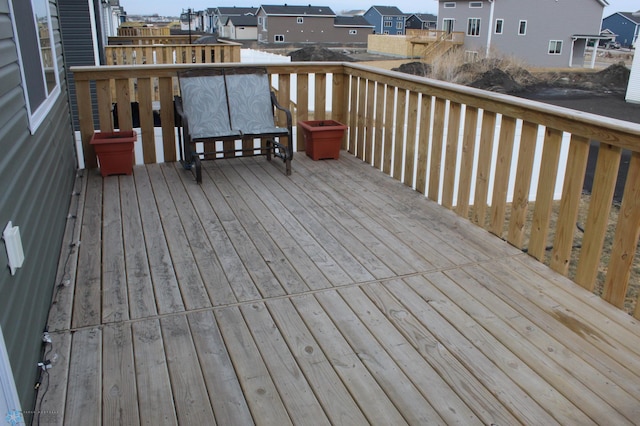 wooden deck with a residential view