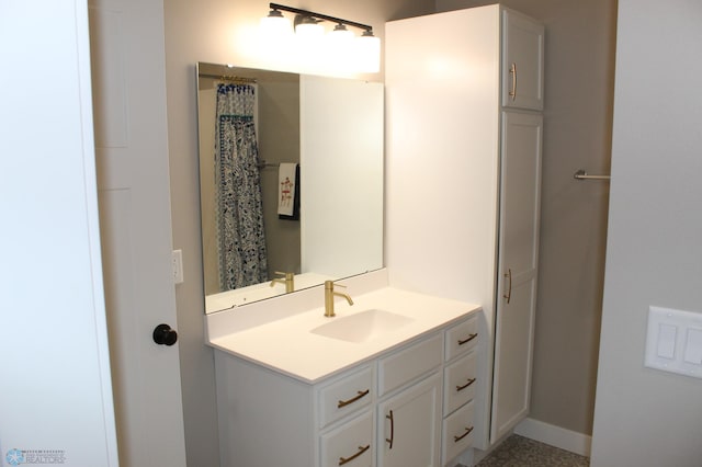 bathroom featuring vanity and baseboards