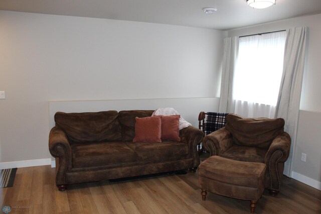 living room with wood finished floors and baseboards