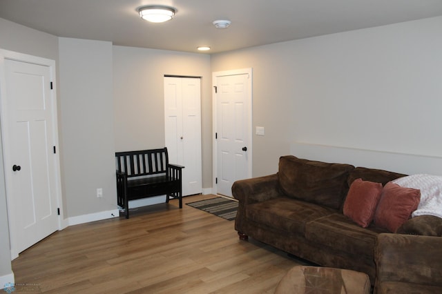 living room with light wood-style floors and baseboards