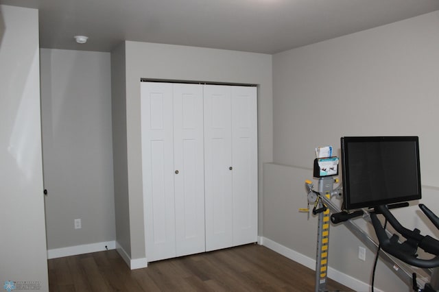 interior space with wood finished floors and baseboards