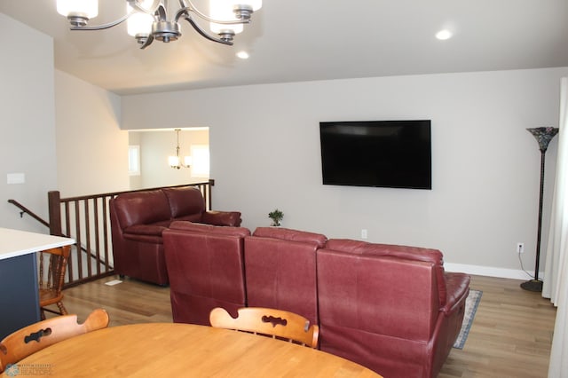 6746 Joseph St, Horace, ND 58047 - living room with a chandelier, wood finished floors, baseboards, and recessed lighting