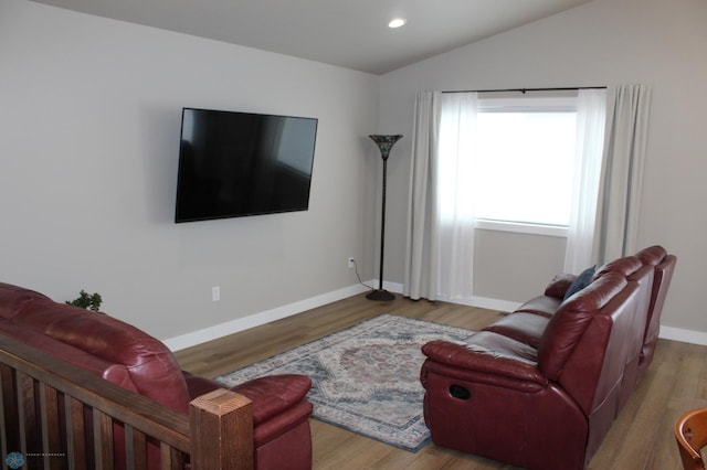 6746 Joseph St, Horace, ND 58047 - living room with lofted ceiling, wood finished floors, baseboards, and recessed lighting