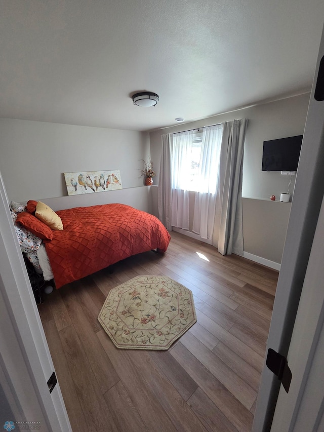 6746 Joseph St, Horace, ND 58047 - bedroom with wood finished floors and baseboards