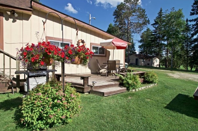 view of yard with a wooden deck