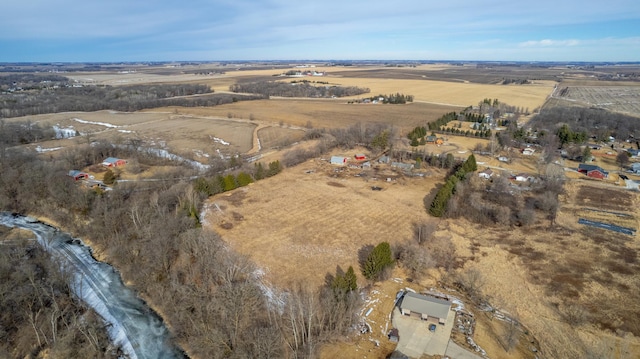 birds eye view of property with a rural view